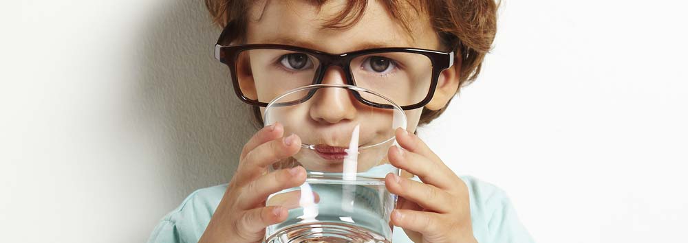 Young Boy Drinking Water